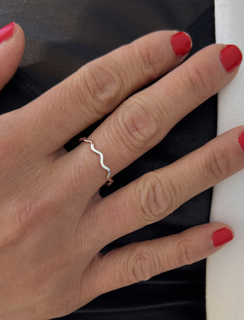 NOODLE sterling silver wave ring worn on a hand